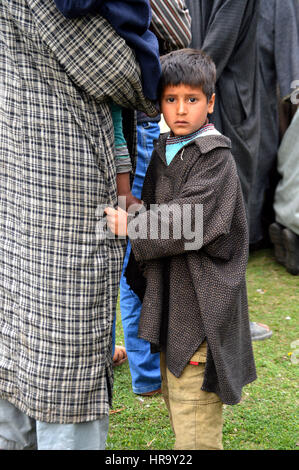 Kashmiri Boy with parents (Photo Copyright © by Saji Maramon) Stock Photo