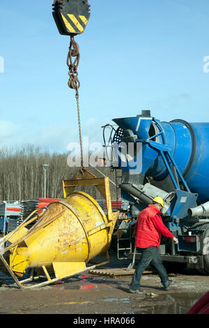 cement truck unloading on constyruction site and blue sky Stock Photo