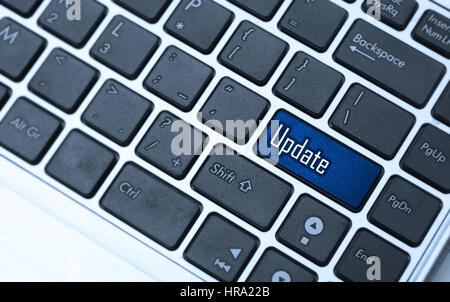 Keyboard with blue key button - Update Stock Photo