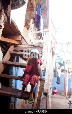 Orphan in the orphanage, Kibera slums, Nairobi, Kenya, East Africa Stock Photo