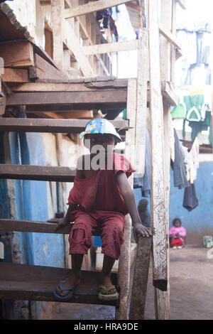 Orphan in the orphanage, Kibera slums, Nairobi, Kenya, East Africa Stock Photo