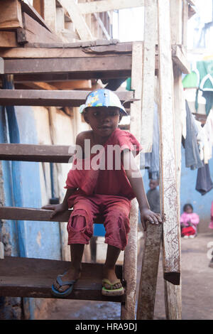 Orphan in the orphanage, Kibera slums, Nairobi, Kenya, East Africa Stock Photo