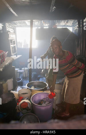 Women preparing food in the kitchens of the orphanage, Kibera slums, Nairobi, Kenya, East Africa Stock Photo