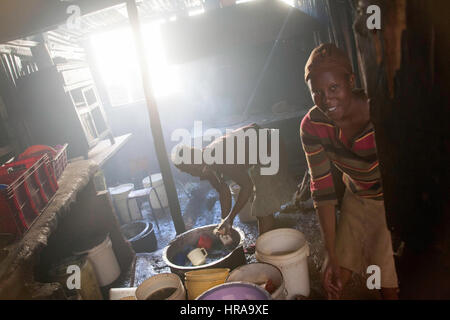 Women preparing food in the kitchens of the orphanage, Kibera slums, Nairobi, Kenya, East Africa Stock Photo