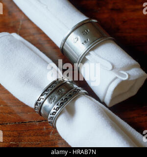 Napkins in silver napkin rings. Stock Photo