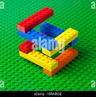 Colourful Lego brick construction or staircase on a green Lego base plate. Stock Photo