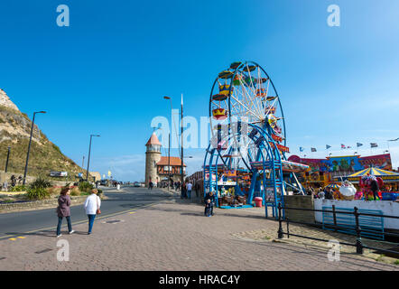 Small funfair beside the harbour at Scarborough, a seaside town on the coast of North Yorkshire, England.