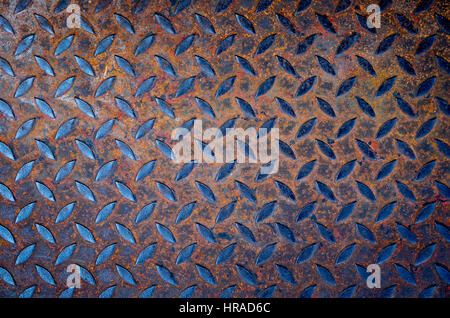 Background of old metal diamond plate with Rusted. Stock Photo