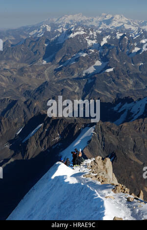 Climbers on the summit ridge og Huayna Potosi in the Bolivian Andes Stock Photo