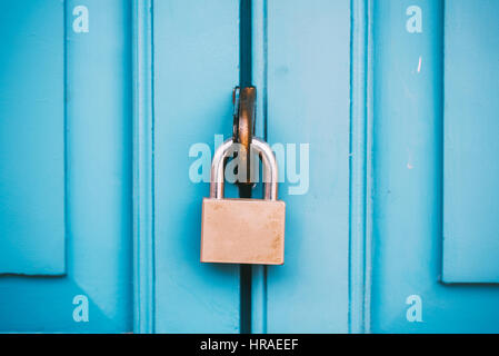 Closed vintage lock on wooden door. Stock Photo