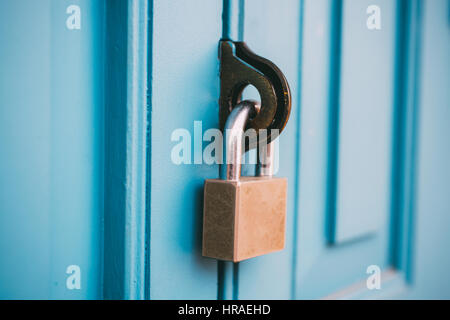 Closed vintage lock on wooden door. Stock Photo