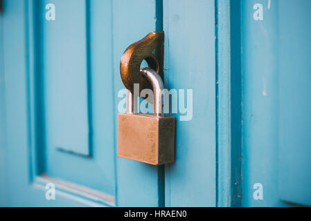 Closed vintage lock on wooden door. Stock Photo