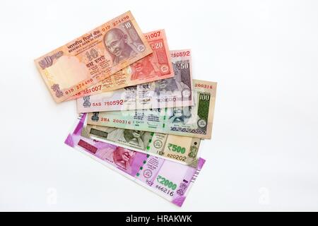 Indian Rupees - Indian currency notes of various denominations on a white background Stock Photo