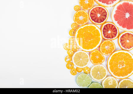 Colorful fresh citrus fruit on white background. Orange, tangerine, lime, blood orange, grapefruit. Fruit background. Summer food concept. Flat lay, t Stock Photo