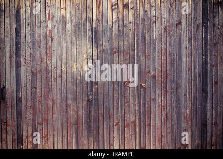 wood wall background texture / old wood wall closeup background photo texture. Color filter effects, and some fine film noise added Stock Photo