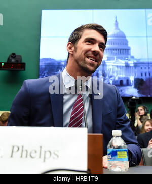 Washington, DC, USA. 28th Feb, 2017. U.S. Olympic gold medalist Michael Phelps prepares to testify before the House Energy and Commerce Subcommittee on Oversight and Investigations during a hearing on 'Ways to Improve and Strengthen the International Anti-Doping System' on the Capitol Hill in Washington, DC, the United States, Feb. 28, 2017. Credit: Bao Dandan/Xinhua/Alamy Live News Stock Photo