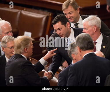 Washington, DC, USA. 28th Feb, 2017. United States President Donald J. Trump chats with US Representative Jason Chaffetz (R-UT) after addressing a joint session of Congress on Capitol Hill in Washington, DC, February 28, 2017. Credit: MediaPunch Inc/Alamy Live News Stock Photo