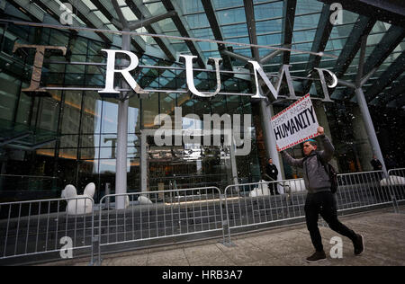 Vancouver, Canada. 28th Feb, 2017. A man protests outside the Trump International Hotel and Tower in Canada's Vancouver on Feb. 28, 2017, the building's official opening day. Credit: Liang Sen/Xinhua/Alamy Live News Stock Photo