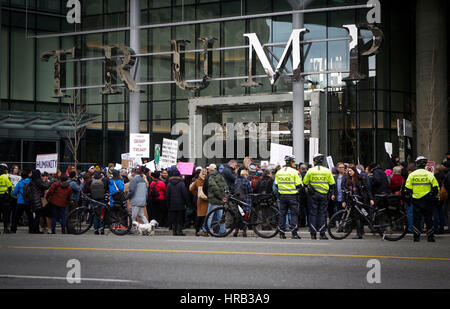 Vancouver, Canada. 28th Feb, 2017. People protest outside the Trump International Hotel and Tower in Canada's Vancouver on Feb. 28, 2017, the building's official opening day. Credit: Liang Sen/Xinhua/Alamy Live News Stock Photo