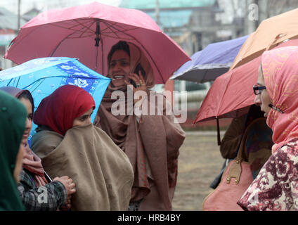 Srinagar, Kashmir. 1st Mar, 2017. Employees of National Rural Health Mission hold a protest demonstration during rain day against their demands . Credit: Sofi Suhail/Alamy Live News Stock Photo