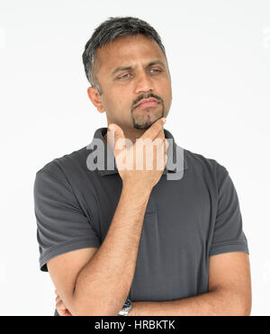 Adult man touching his face thoughtful gesture Stock Photo