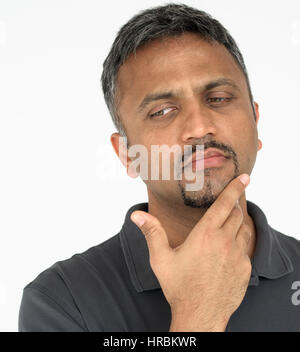 Adult man touching his face thoughtful gesture Stock Photo