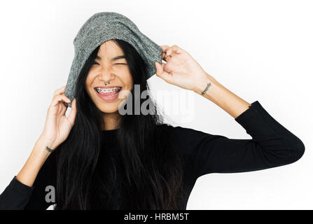 Young woman casual with tattoo holding beanie Stock Photo