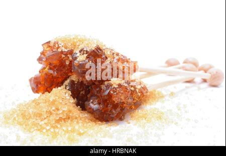 Brown sugar crystal on wooden stick Stock Photo