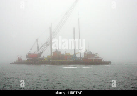 Portland Harbor marine construction barge tug boats crane boat Portland Maine New England USA Stock Photo