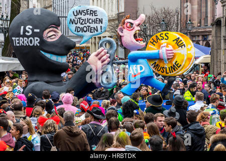 German Carnival parade in DŸsseldorf, Carnival floats designed as political caricatures, IS terrorist is using German right wing political party AFD f Stock Photo