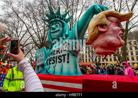 German Carnival parade in DŸsseldorf, Carnival floats designed as political caricatures, showing Lady Liberty is beheading US president Donald Trump,  Stock Photo