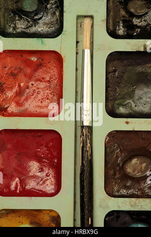 art set of watercolor paints, used box brush macro shot, creativity artist, work tool, Stock Photo