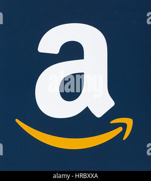 MONTREAL, CANADA - FEBRUARY 28, 2017: Amazon logo printed on a blue paper. Amazon is an American electronic commerce and cloud computing company that  Stock Photo