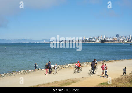 At Crissy Field cyclists and pedestrians enjoy the sunny weather in Golden Gate National Park. San Francisco, California, USA Stock Photo