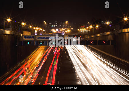 A long exposure of cars driving down the motorway into Birmingham, UK Stock Photo