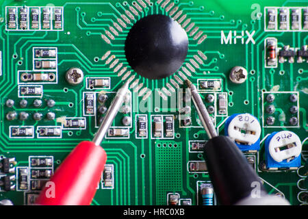 Measuring a processor board for repair Stock Photo