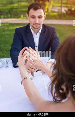 Young man making a proposal of marriage. Love, couple, date, wedding concept Stock Photo