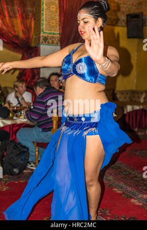 Marrakesh, Morocco - December 8, 2016: A female dancer performing in a restaurant Dar Es-Salam in Marrakesh, Morocco. Stock Photo