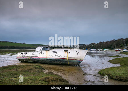 remains boat abandoned beached Gannel Estuary gloomy overcast day Newquay Cornwall UK weather Stock Photo