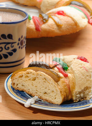 Chocolate cup with Epiphany cake, Kings cake, Rosca de reyes or Roscon de reyes Stock Photo