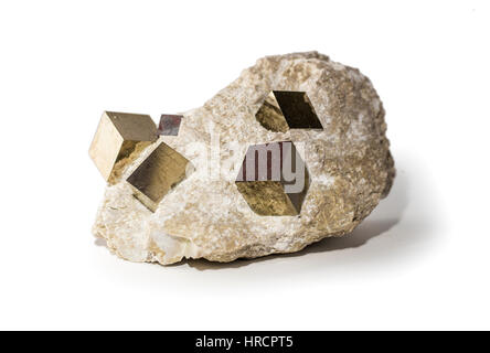 Pyrite or fool's gold crystals in stone placed on white background. Horizontal studio shot. Stock Photo