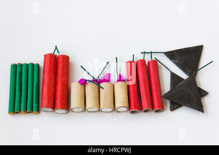 Firecrackers of different types and shapes on a white background Stock Photo