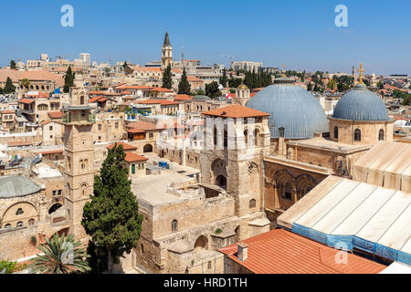 Church of the Holy Sepulchre domes, minarets and rooftops of the Old City of Jerusalem, Israel as seen from above. Stock Photo