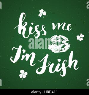 Kiss me, I'm irish. St Patrick's Day greeting card Hand lettering with lips and clovers, Irish holiday brushed calligraphic sign vector illustration Stock Vector