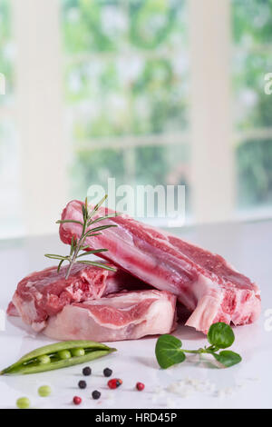Raw lamb chops with vegetables and spice Stock Photo