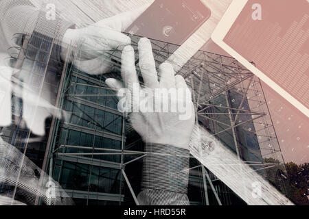 double exposure of man hand using VOIP headset with digital tablet computer docking keyboard,smart phone,concept communication, it support, call cente Stock Photo