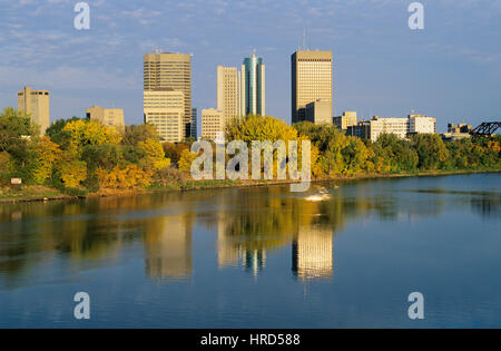 View of the Central Business District reflected in the Red River, Winnipeg, Manitoba, Canada Stock Photo