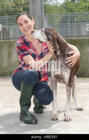 shelter keeper loves her residents Stock Photo