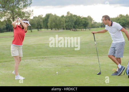 golfer trying to hit the ball Stock Photo