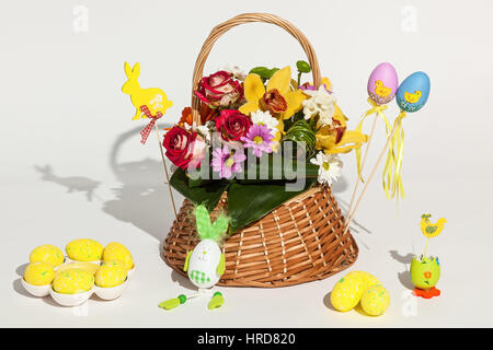 Flowers and eggs. Beautiful set of different flowers and Easter painted eggs isolated on white background. Stock Photo